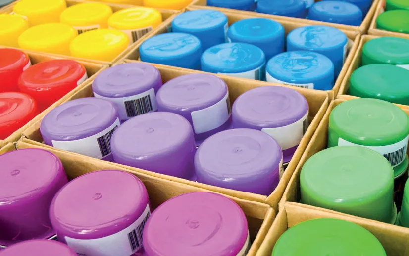 Trays of Ritver aerosol spray paint cans in assorted colours