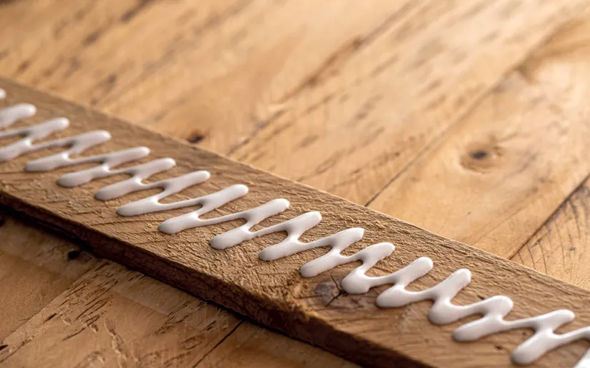Bead of Ritver wood adhesive applied along a timber joint