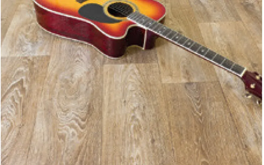 Guitar resting on an anti-scratch coated wooden floor